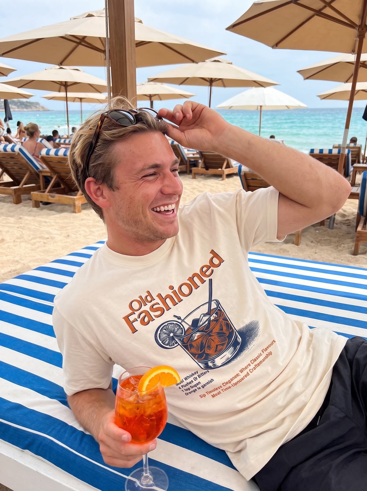 Sip Club tee at a beach club