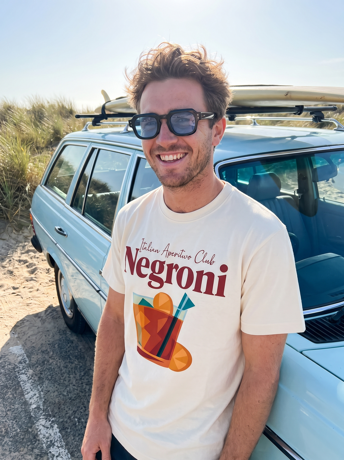 Aperitivo Hour tee and Monaco sunglasses on a beach road trip
